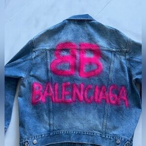 Balenciaga denim jacket with fuchsia writing.